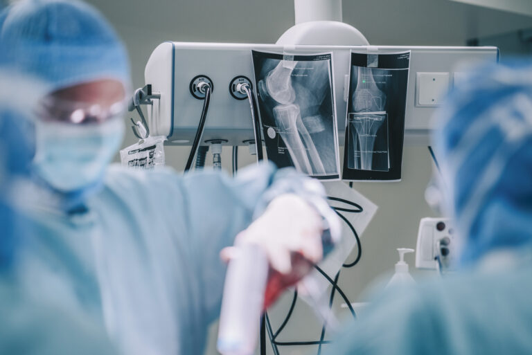 Surgeons doing operation in hospital operating room